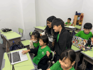 Navya and Iman exploring Arduino projects with students at Chumbaka Malaysia