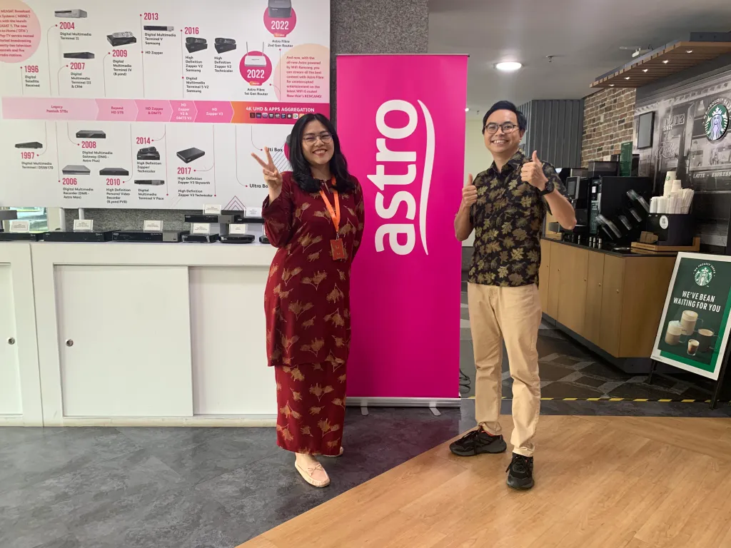 Teacher mentoring students using AI tools in a Malaysian classroom